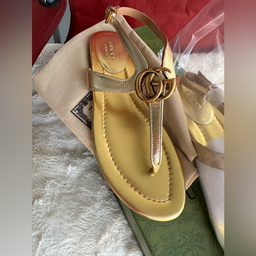 Beautiful never worn size 39 GG gold sandals. They were a gift and do not fit.